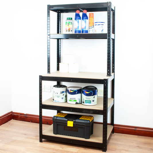A 5-tier black metal storage shelf with beige wood-look panels, shown holding various household and workshop items like paint cans, bottles, and a toolbox, set against a plain white wall and wood floor.