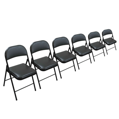 Six black folding chairs arranged in a diagonal row on a plain white background.