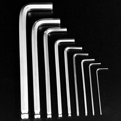 A set of eight silver metal hex wrenches in graduated sizes, arranged diagonally from largest to smallest on a solid black background.