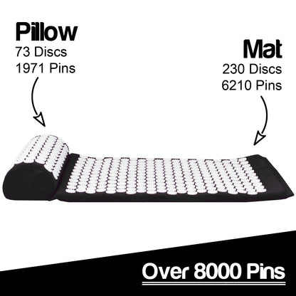 A black and white acupressure mat with a matching headrest, shown on a white background with text labels indicating the pillow has 73 discs/1971 pins and the mat has 230 discs/6210 pins, plus a black banner at the bottom reading 'Over 8000 Pins'.