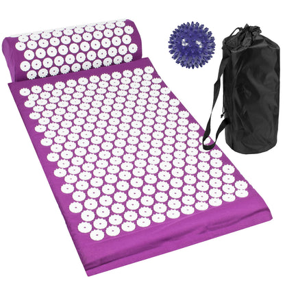 Purple acupressure mat with white circular massage nodes, shown with a matching purple pillow, a blue textured ball, and a black drawstring storage bag on a white background.