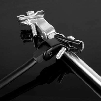 Close-up of black and silver bike kick stands with threaded bolts and adjustment knobs, shown against a dark reflective background.