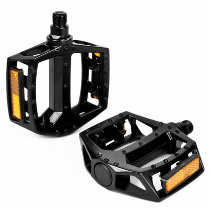 Black bike pedals with yellow reflectors on a white background