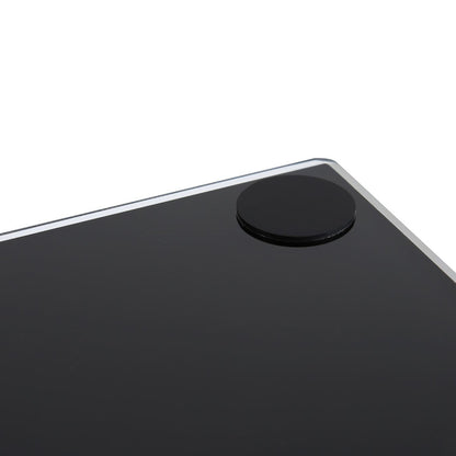 Close-up of the top corner of a black glossy tablet or smartphone showing a circular black camera cutout and a thin silver edge against a white background.