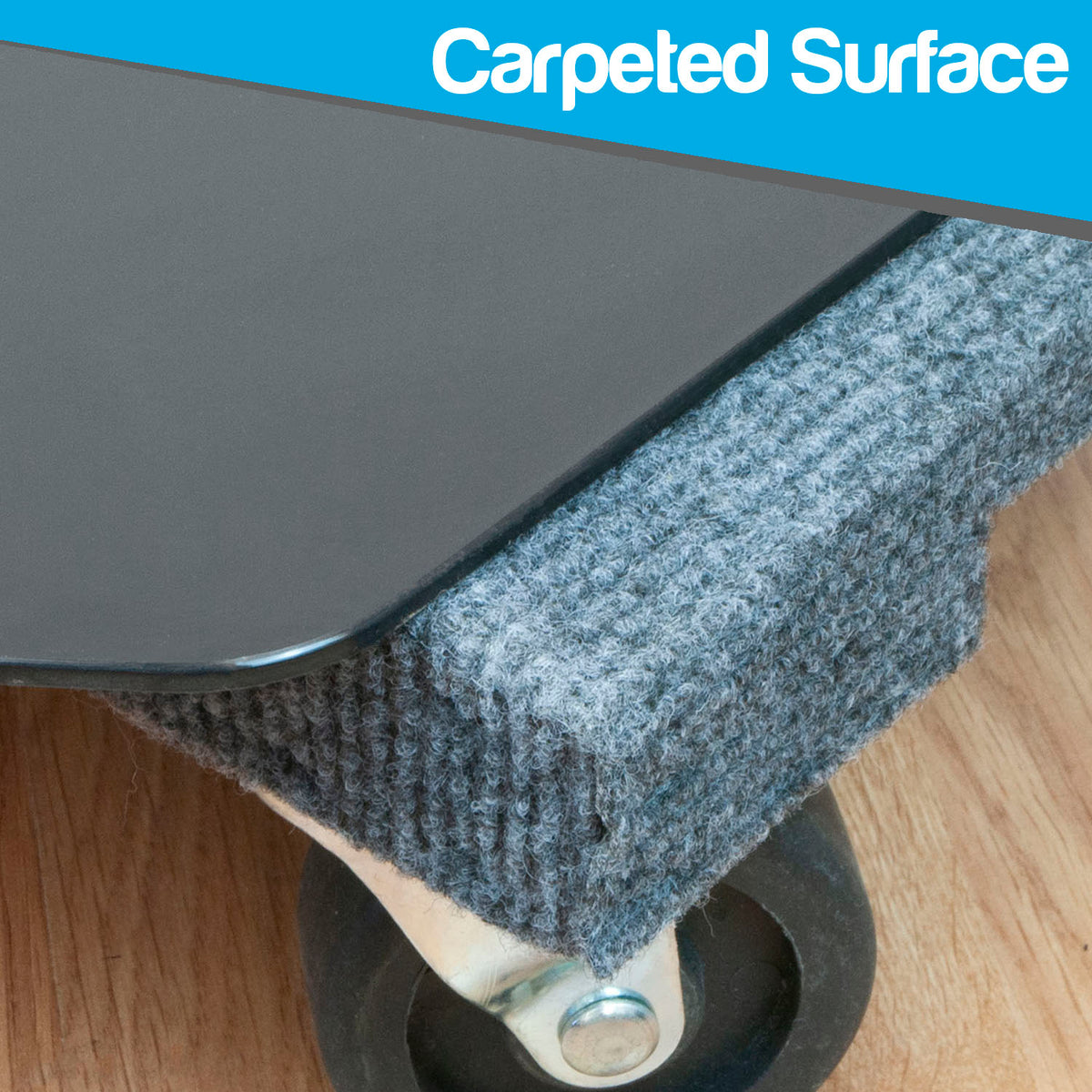 Close-up of a dark gray carpeted wheeled furniture base on a wood floor, with a blue banner at the top reading 'Carpeted Surface'.