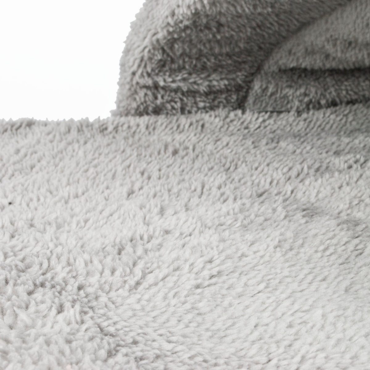 Close-up of a textured gray fabric surface in a pet bed