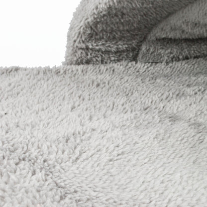 Close-up of a textured gray fabric surface in a pet bed