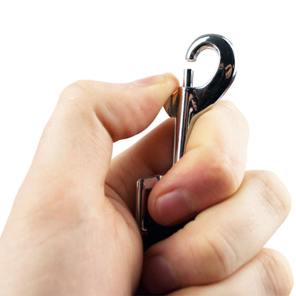A close-up of a hand holding a shiny silver metal hook accessory against a plain white background.