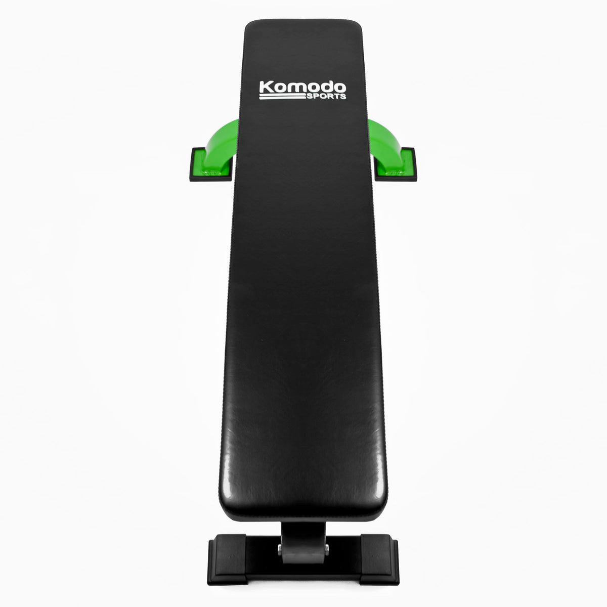 A black weight bench with green supports and a white Komodo Sports logo on the cushion, shown against a plain white background.