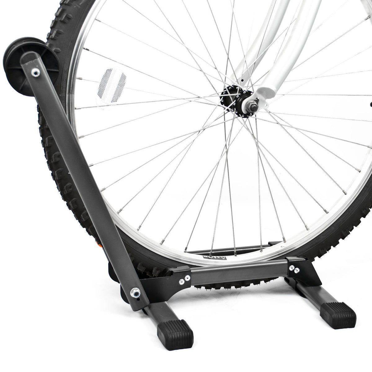 A black metal bicycle wheel stand holding a rear bicycle wheel against a clean white background.