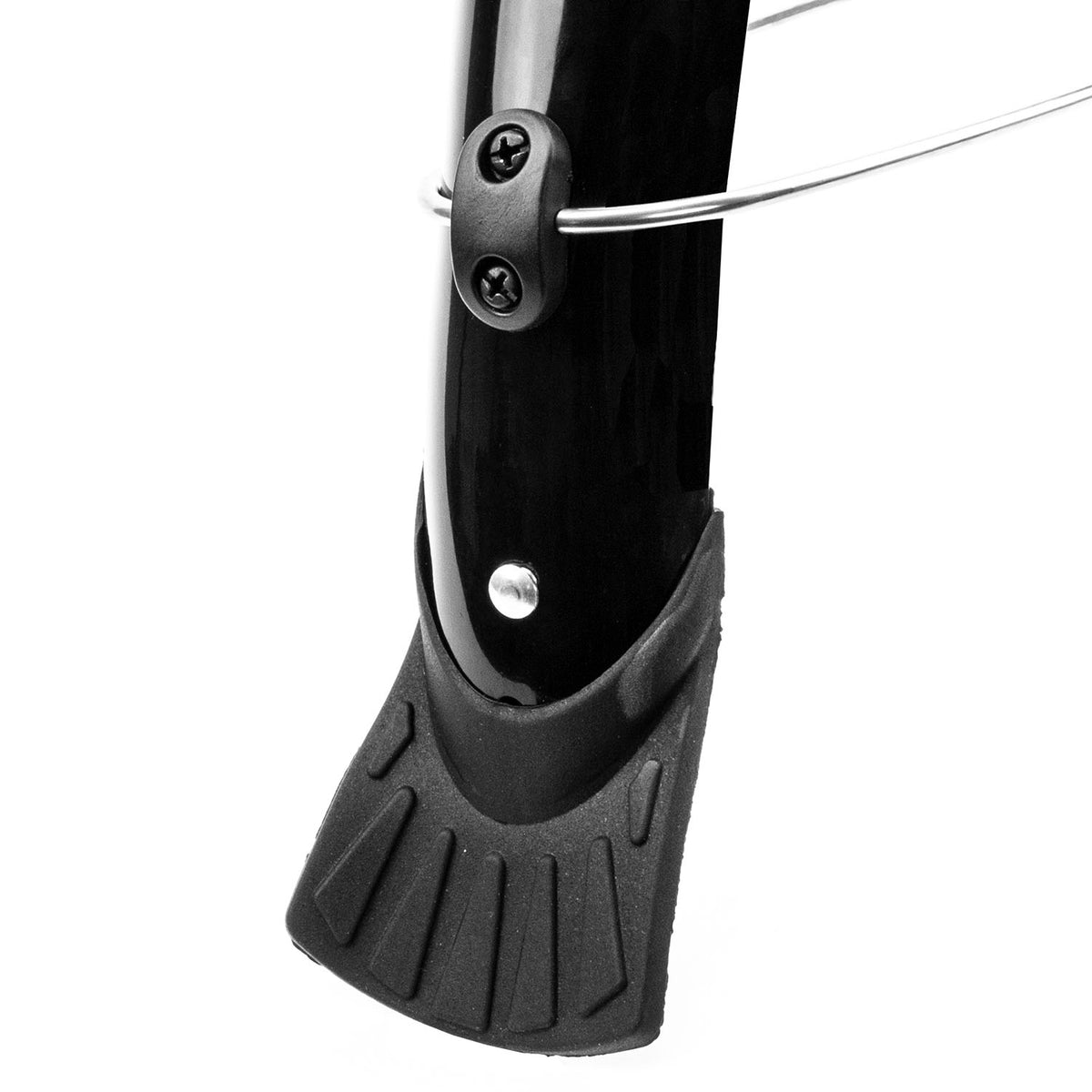 Close-up of a black bicycle wheel mudguard and a thin silver metal wire visible near the top, photographed on a white background.