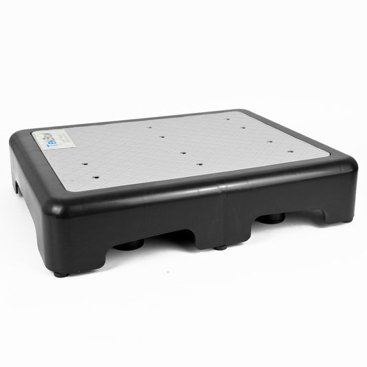 A black plastic step platform with a textured gray top surface, photographed on a clean white background.