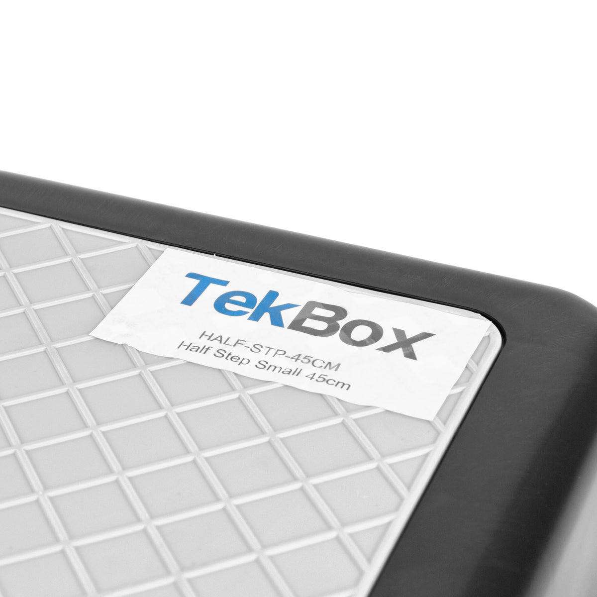 Close-up of a TekBox Half Step Small 45cm label with a grey grid surface, black frame, and a white label showing the TekBox branding.