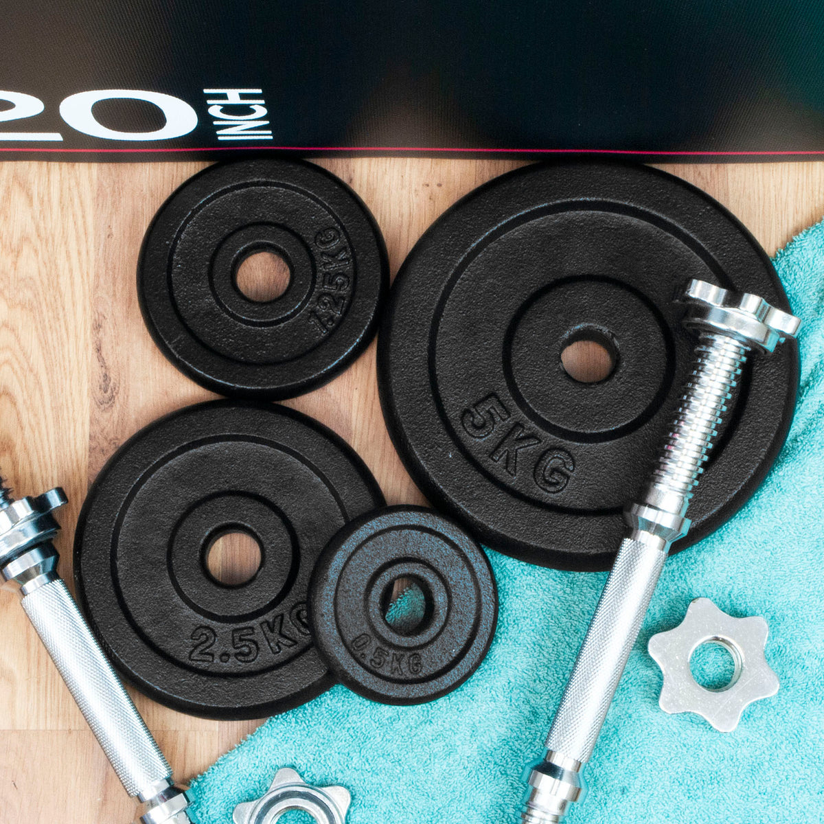 A selection of iron weight plates with spinlock dumbbell bars