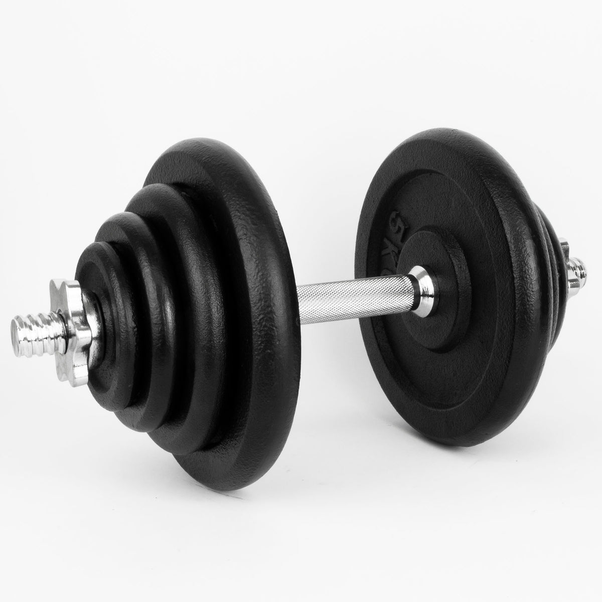 Iron weight plates on a silver dumbbell on a clear white background