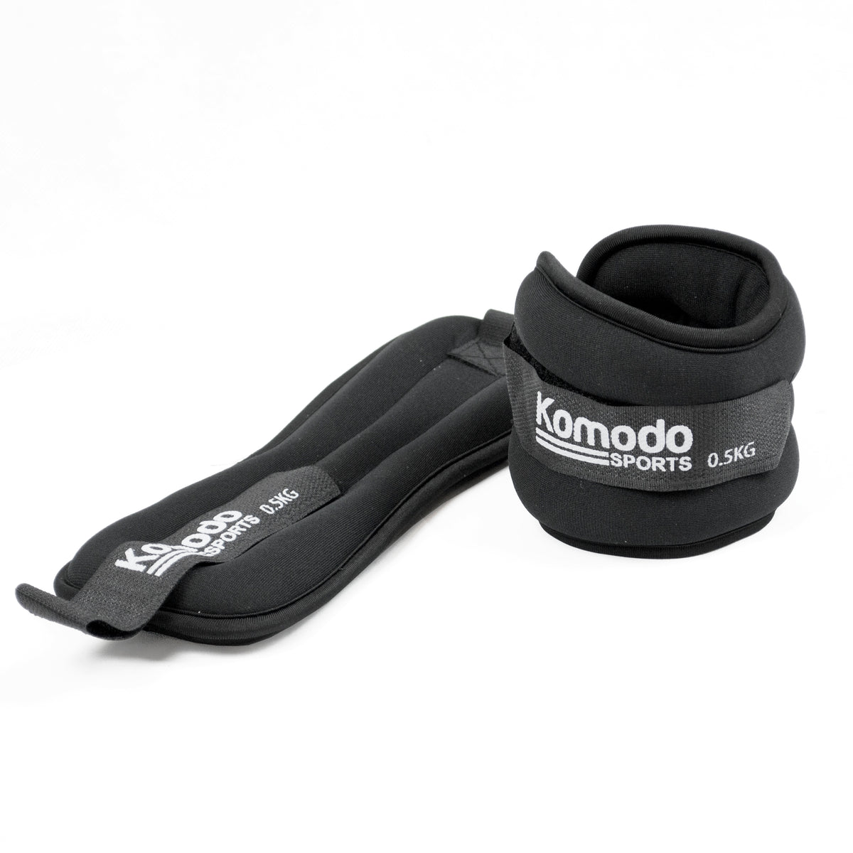 A pair of black Komodo Sports adjustable wrist wraps, each labelled 0.5kg