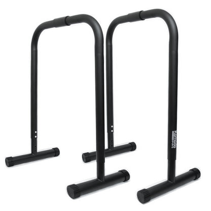 Two black metal push-up or parallel bar stands with T-shaped base plates, shown on a plain white background. A vertical white brand label reading 'Komodo' is visible on the right stand.