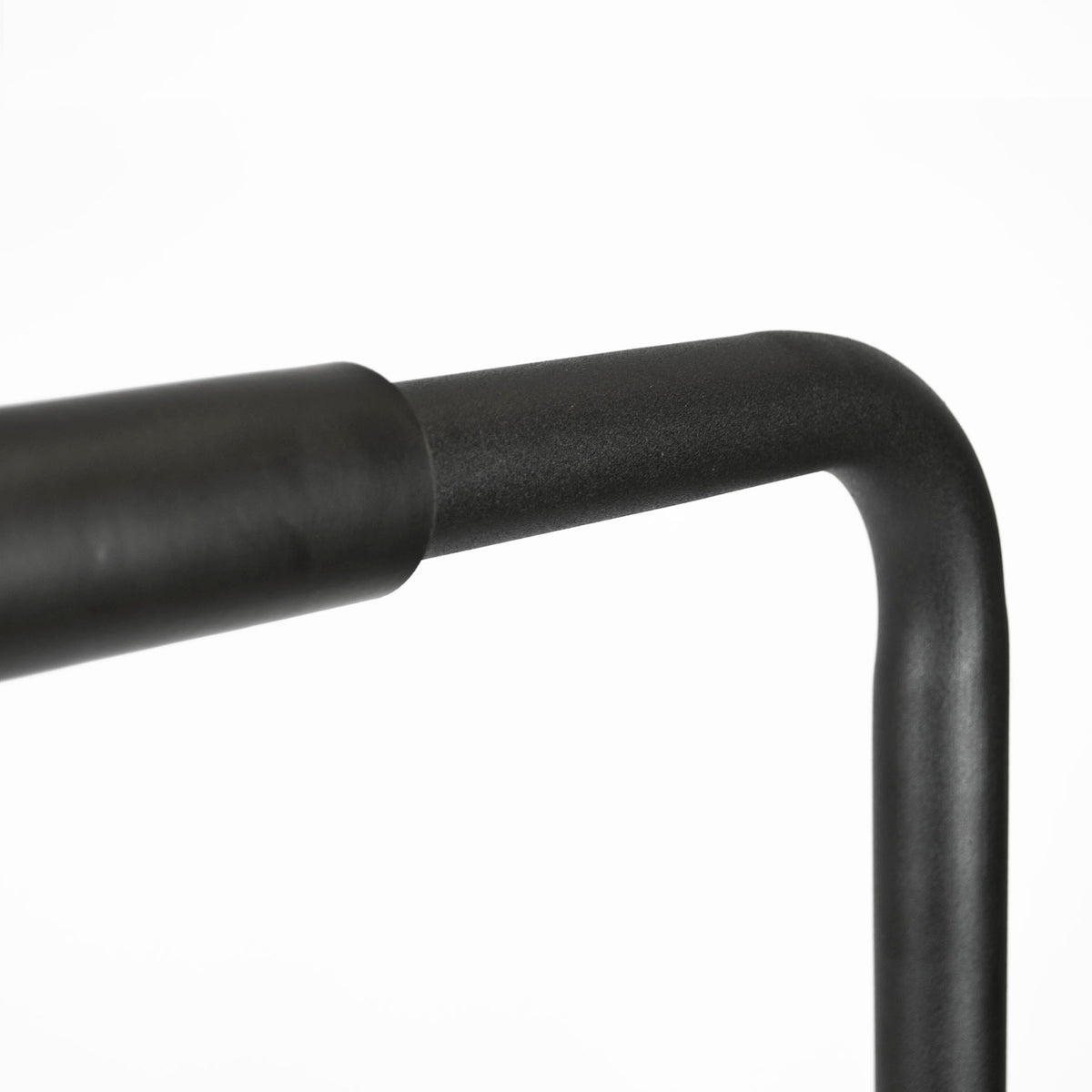 Close-up of a black metal frame bar with a rounded corner and textured finish on a plain white background.