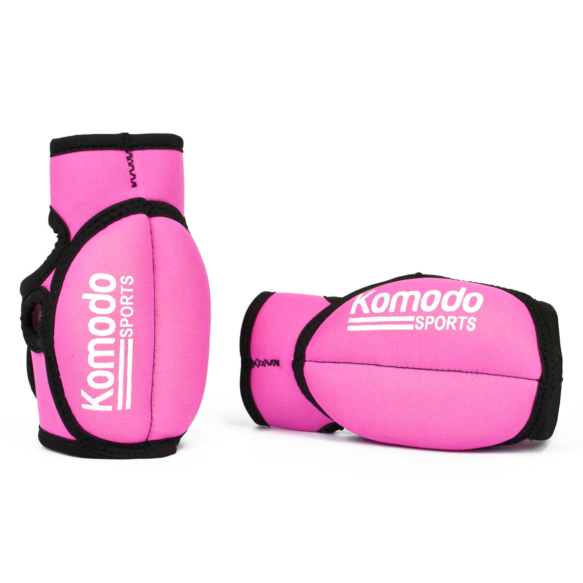 Two pink neoprene fingerless hand grip/weightlifting with black trim and white 'Komodo Sports' branding, displayed on a clean white background.