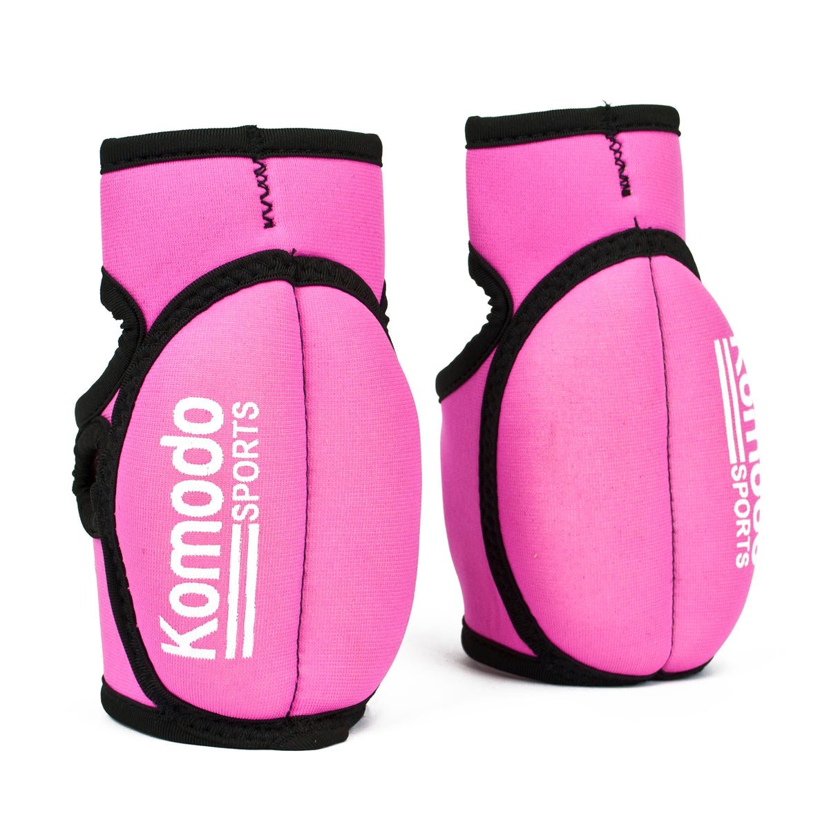 A pair of pink neoprene fingerless hand grip/weightlifting with black trim and white 'Komodo Sports' branding, displayed on a clean white background.