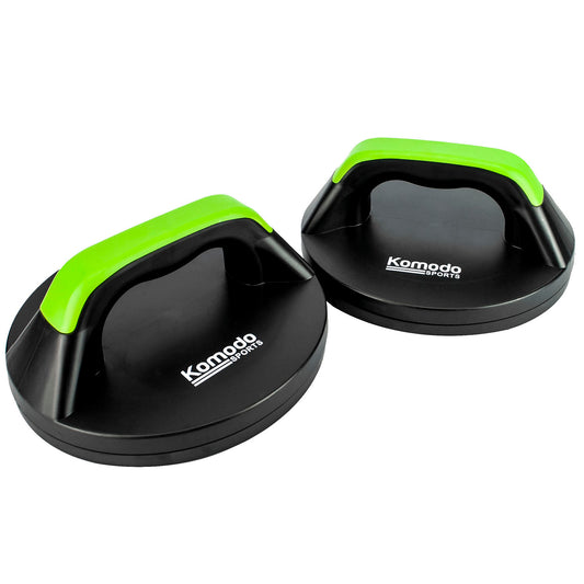 Two black Komodo Sports push-up boards with bright green handles, shown on a clean white background.