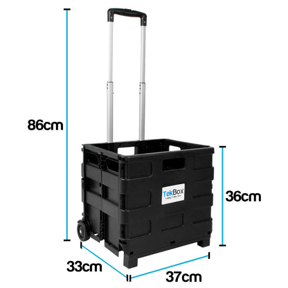 Black TekBox Folding Shopping Trolley Box with an extendable silver handle and wheels, shown with blue dimension lines and labels indicating height, width, and depth measurements on a white background.