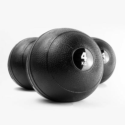 Pair of black slam balls with weight markings on a white background