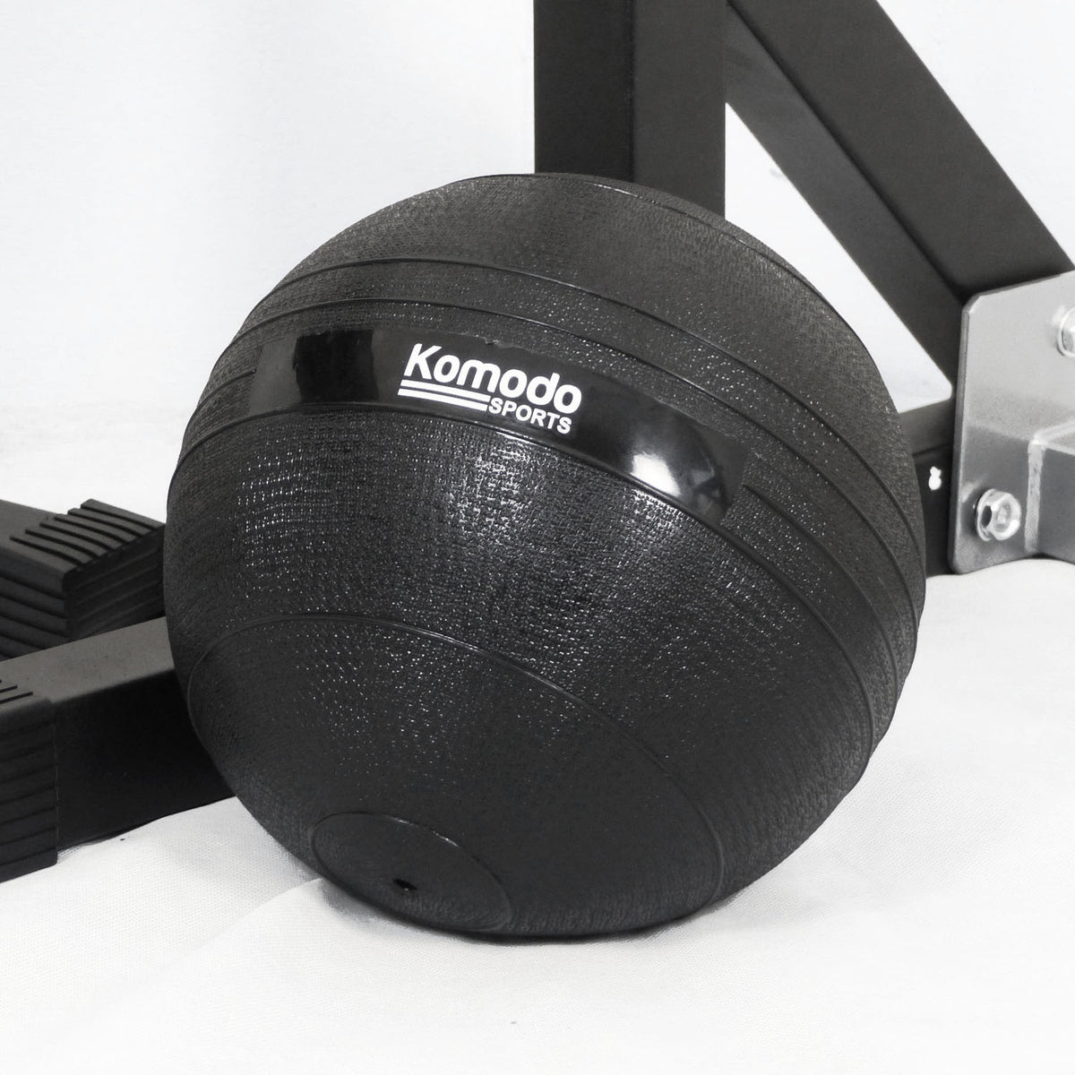 Black slam ball with Komodo Sports logo on a white background