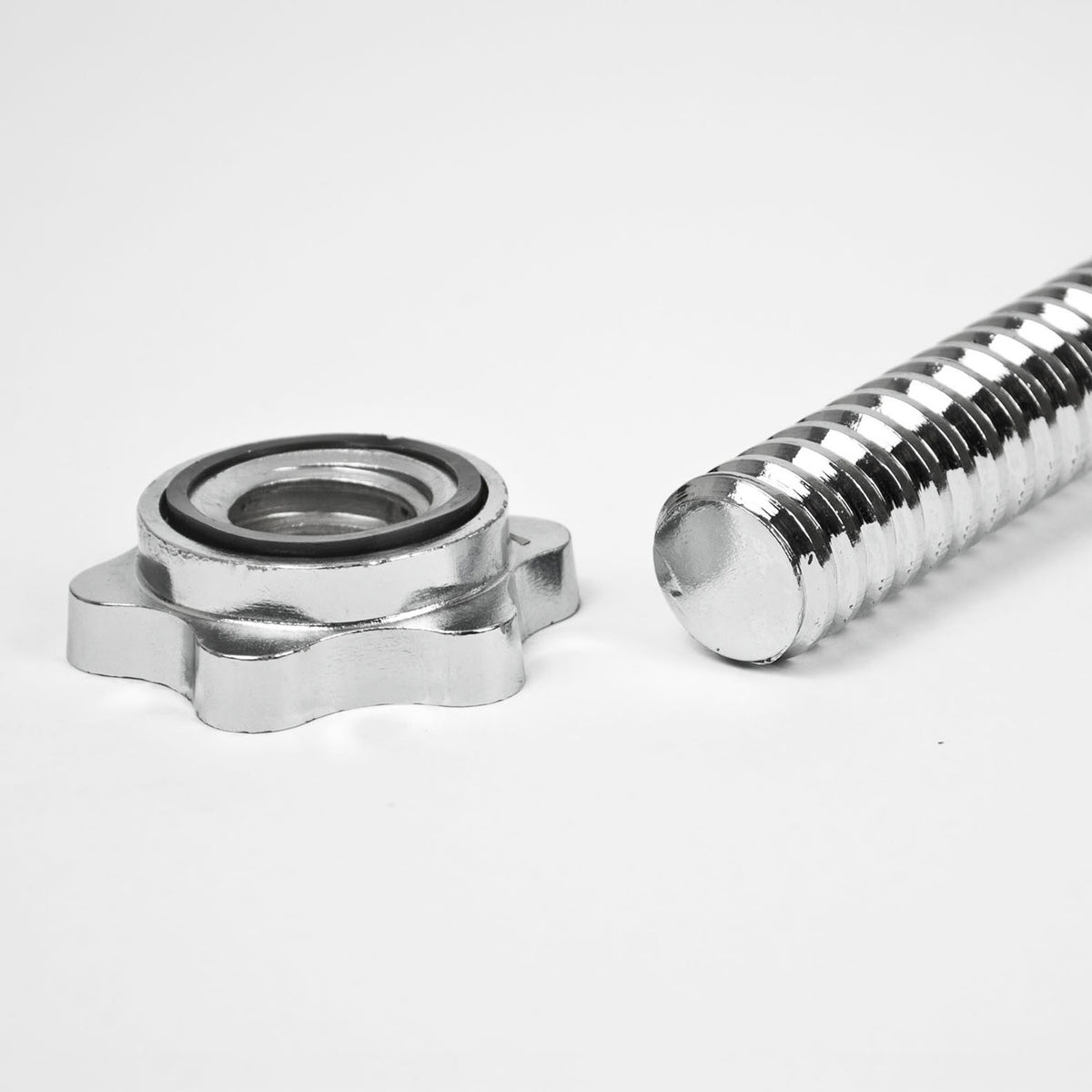 A close-up of a silver metal dumbbell rod and matching star-shaped nut on a clean white background.