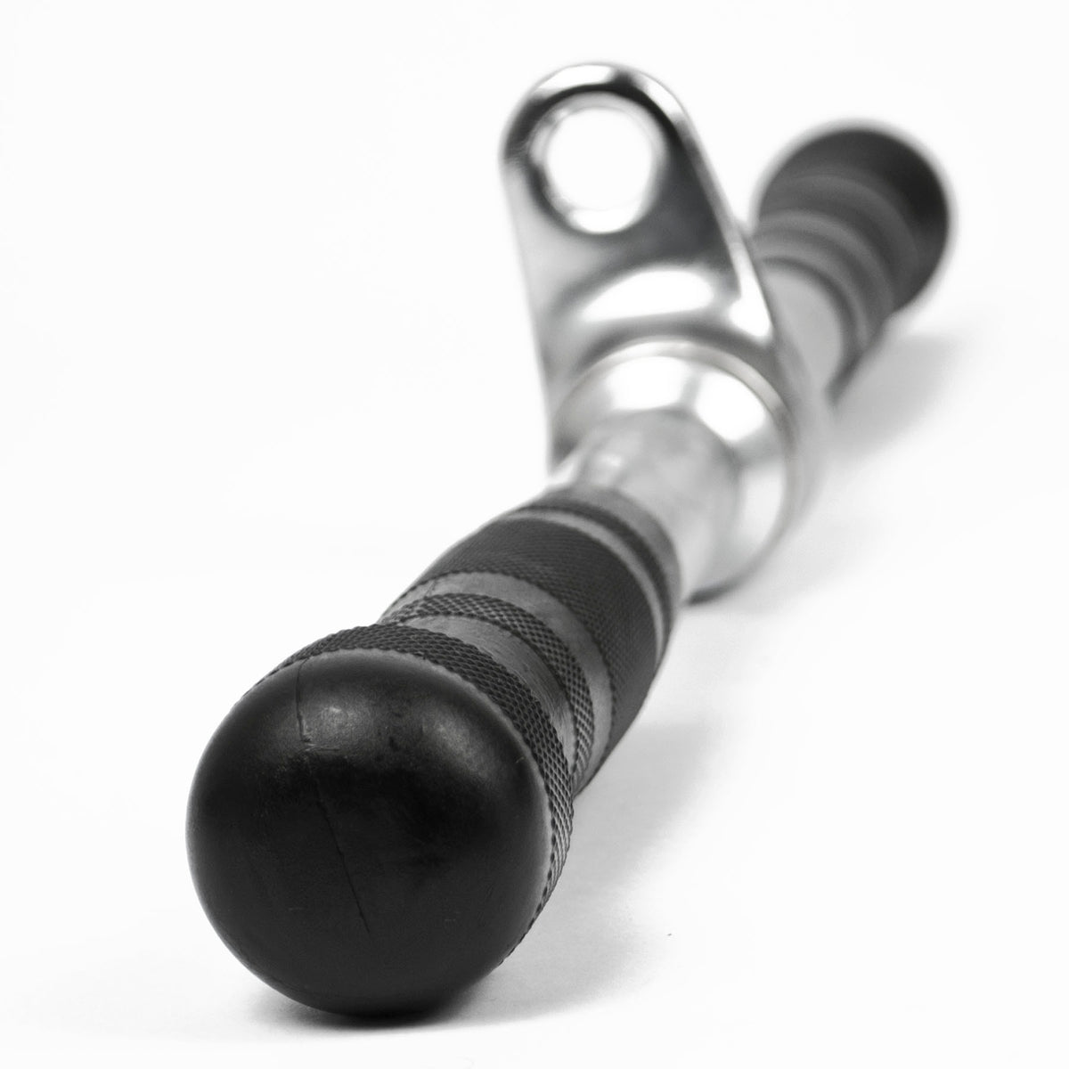 A close-up of a black and silver metal cable pulley system component, featuring a textured black handle with a spherical end cap and a polished silver metal sleeve, set against a plain white background.