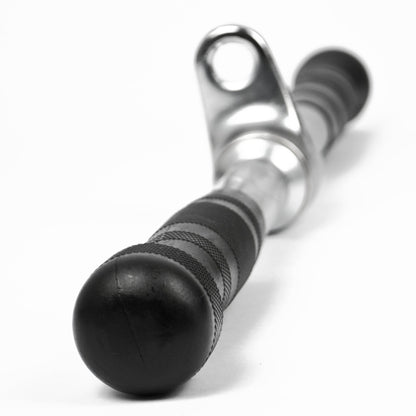 A close-up of a black and silver metal cable pulley system component, featuring a textured black handle with a spherical end cap and a polished silver metal sleeve, set against a plain white background.