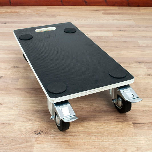 A black utility dolly with casters and locking wheels, shown on a light wood floor.