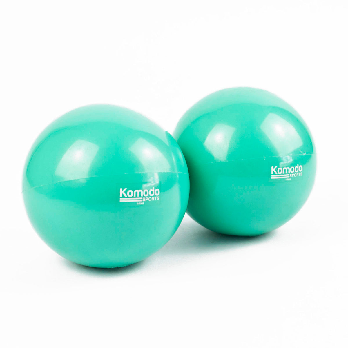 Two green Komodo Sports Weighted Toning Ball  on a white background.