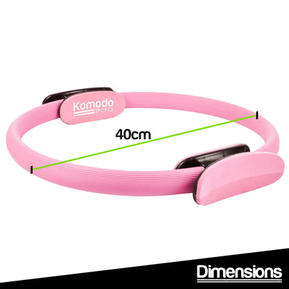 Pink pilates ring with 'Komodo' branding and measurement label on a white background