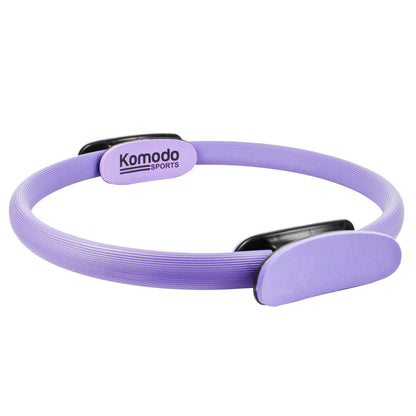 A purple Komodo Sports Pilates reformer band with black plastic adjustment sliders, shown on a clean white background.