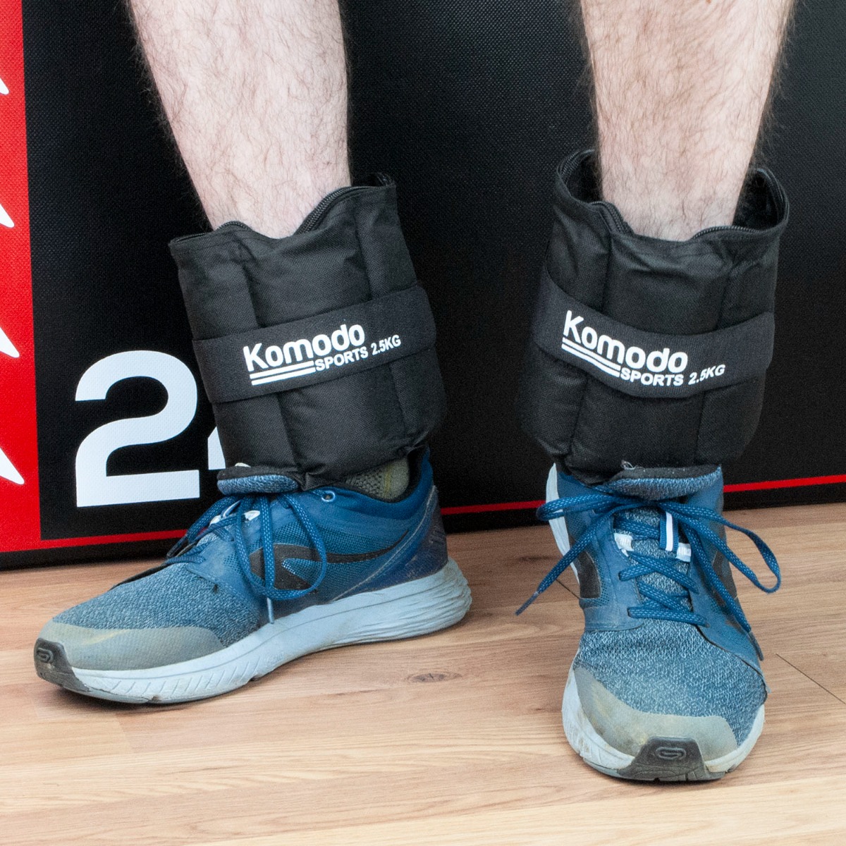 Adjustable wrist and ankle weights with black straps and removable weight pockets for customizable resistance up to 5kg total