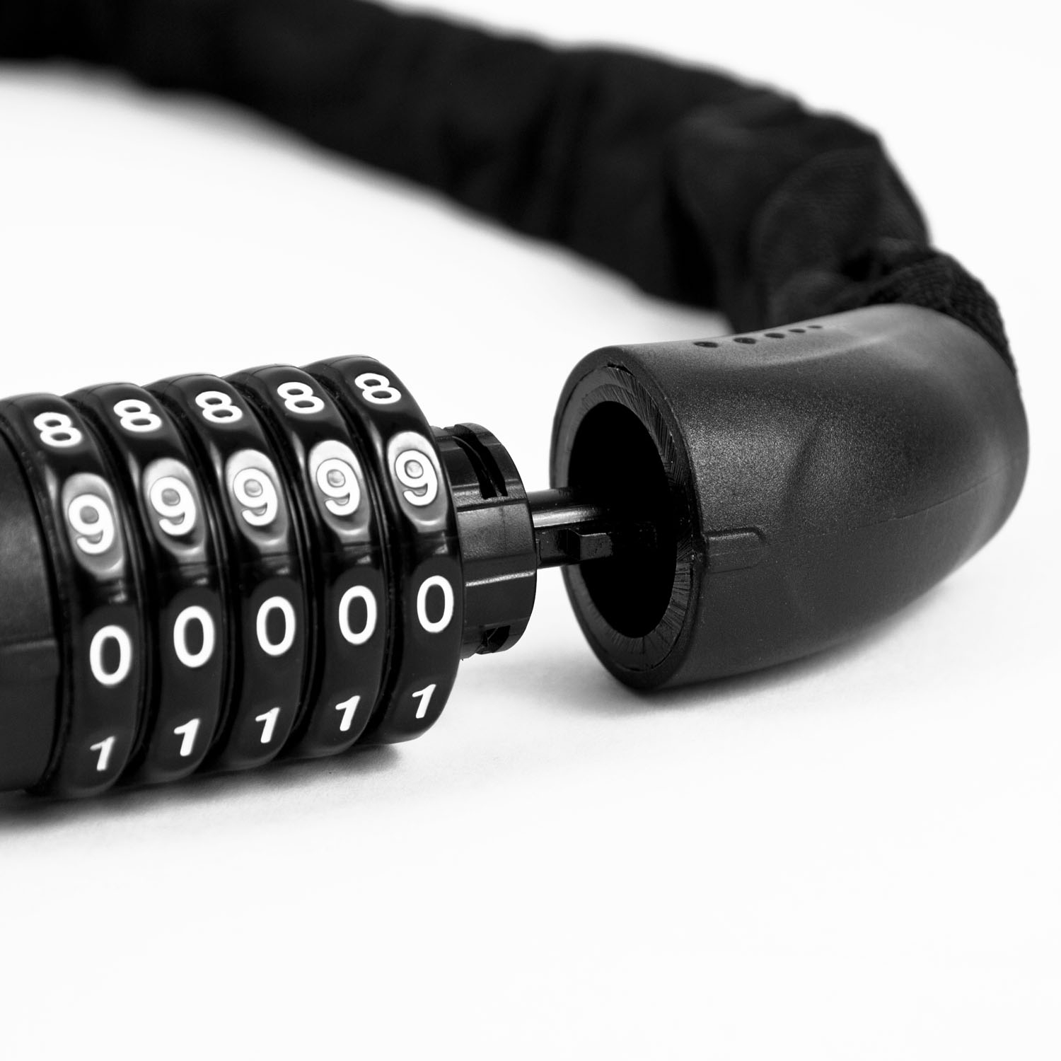 Heavy duty steel chain lock with fabric cover and 5 digit combination lock for securing bikes and tools.