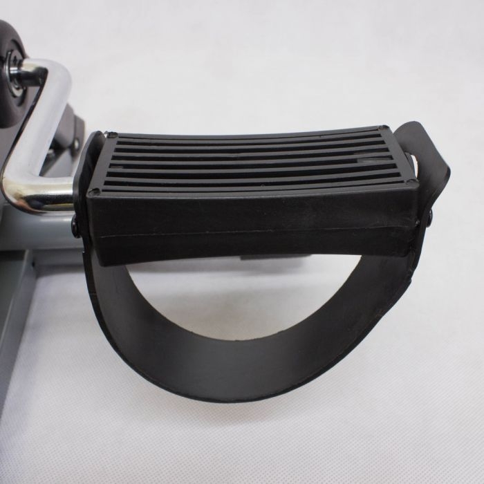 Compact pedal exerciser with digital display and adjustable resistance knob on top, designed for arm and leg workouts