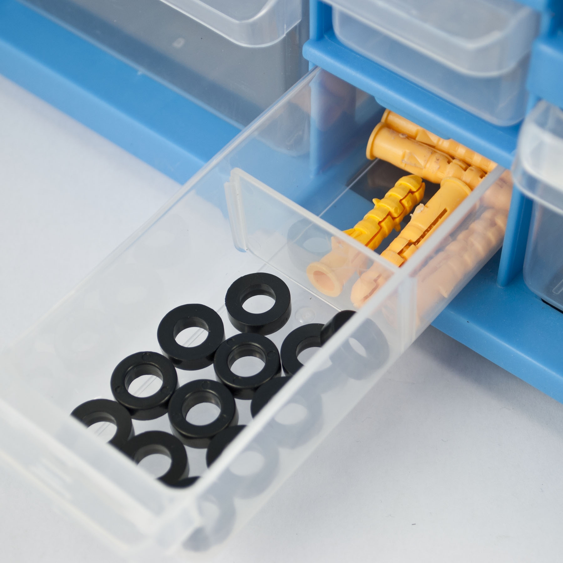 Storage organiser unit with 22 plastic drawers, 14 small and 8 large, featuring handles and stackable design