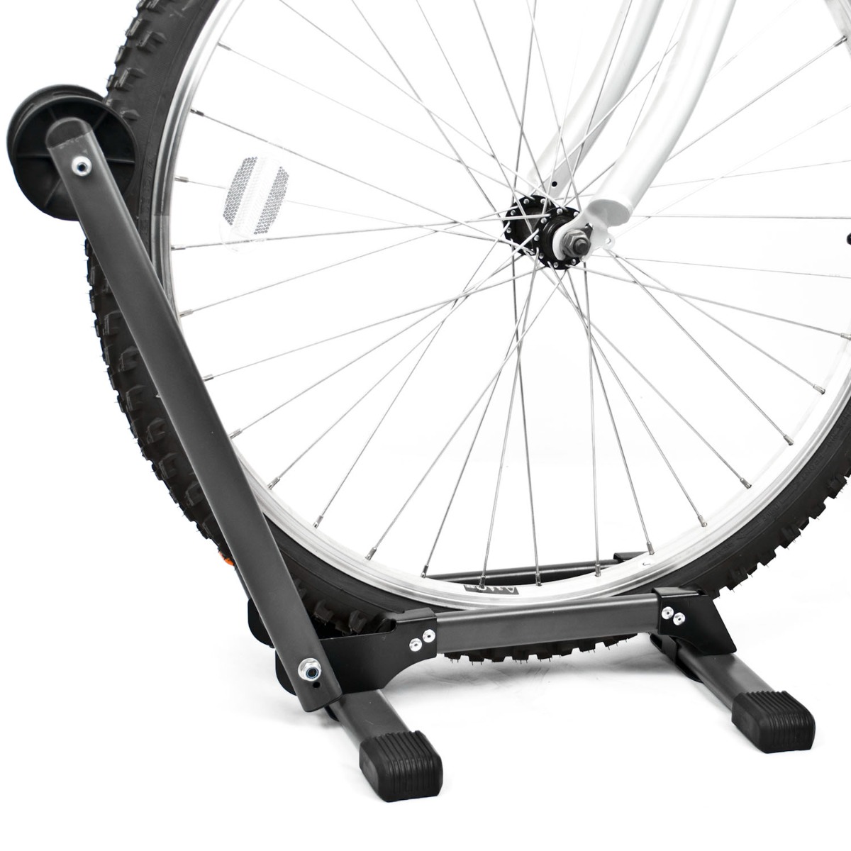 Folding bicycle stand in folded position showing spring-assisted locking bar and compact steel frame design