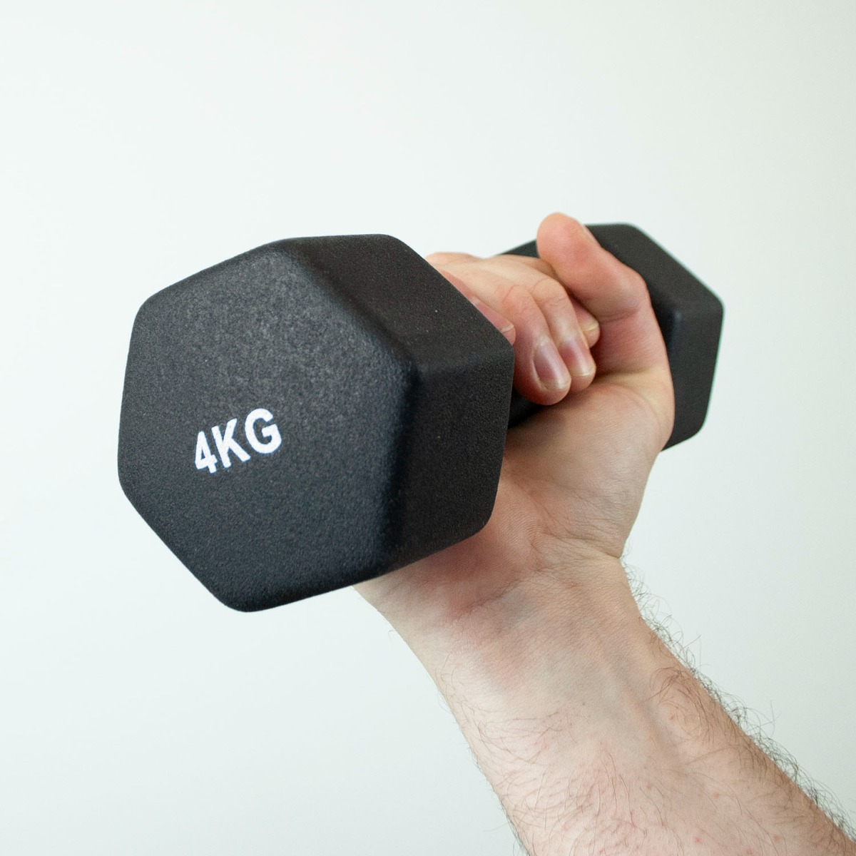 Pair of 4kg iron core dumbbells with black neoprene coating for grip on white background