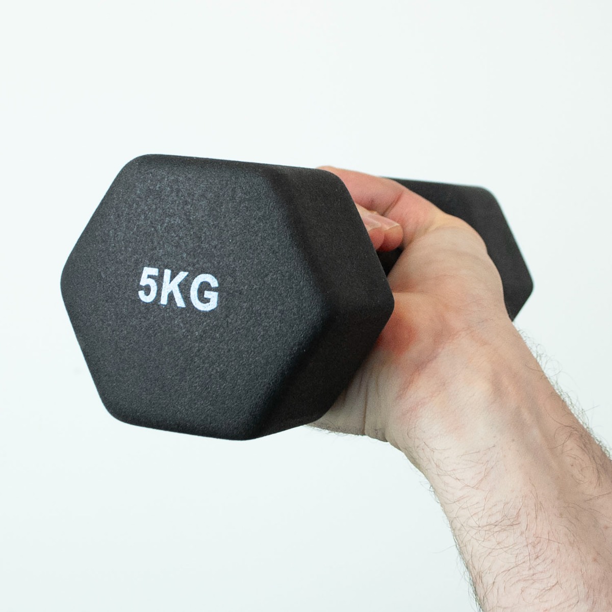 Pair of 5kg iron core dumbbells with black neoprene coating for a secure, comfortable grip on white background