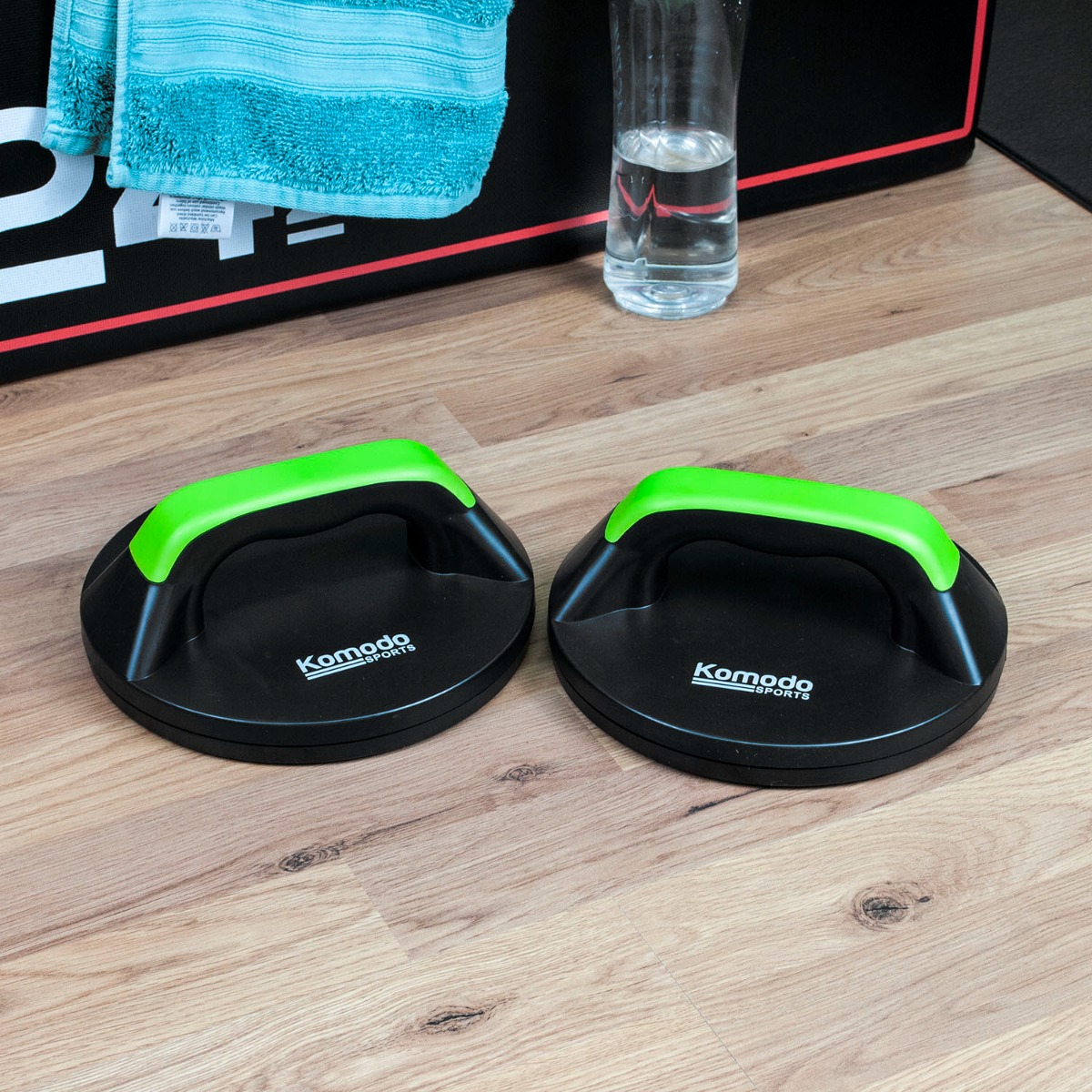 Green Komodo rotating push up handles designed for wrist pain relief handles and enhanced workout comfort and range of motion