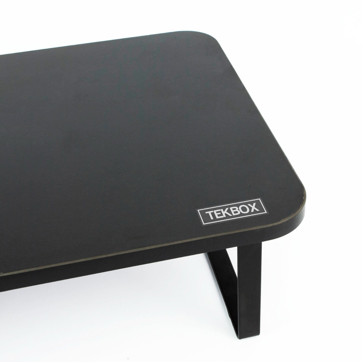 Double desk monitor riser stand holding two computer screens with space underneath for keyboard or office supplies