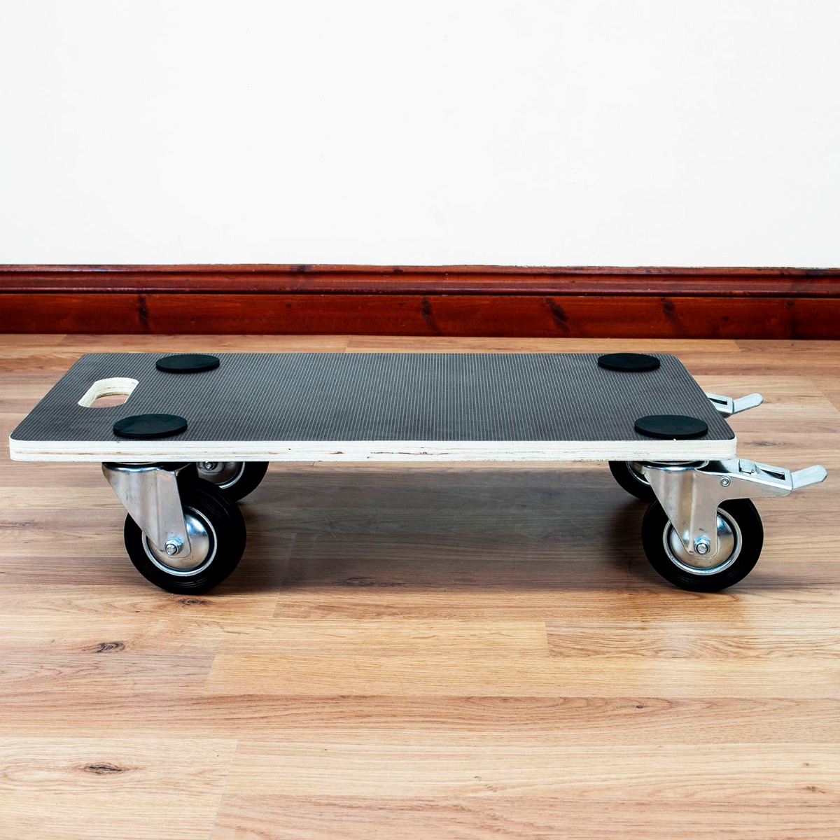 Wooden furniture moving trolley with 4 swivel wheels, anti-slip surface, corner pads, and carry handle on a white background