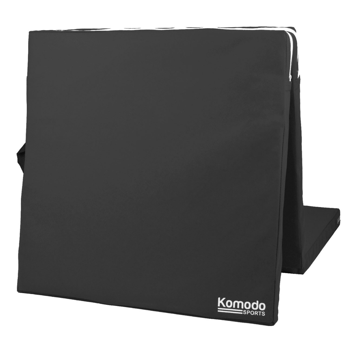 Black Komodo tri folding high density yoga mat folded with built-in handles for easy carrying and storage