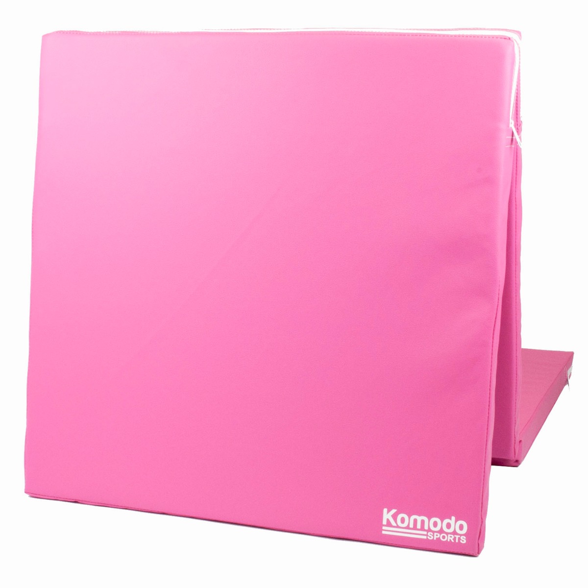 Pink Komodo tri folding high density yoga mat folded with built-in handles for easy carrying and storage