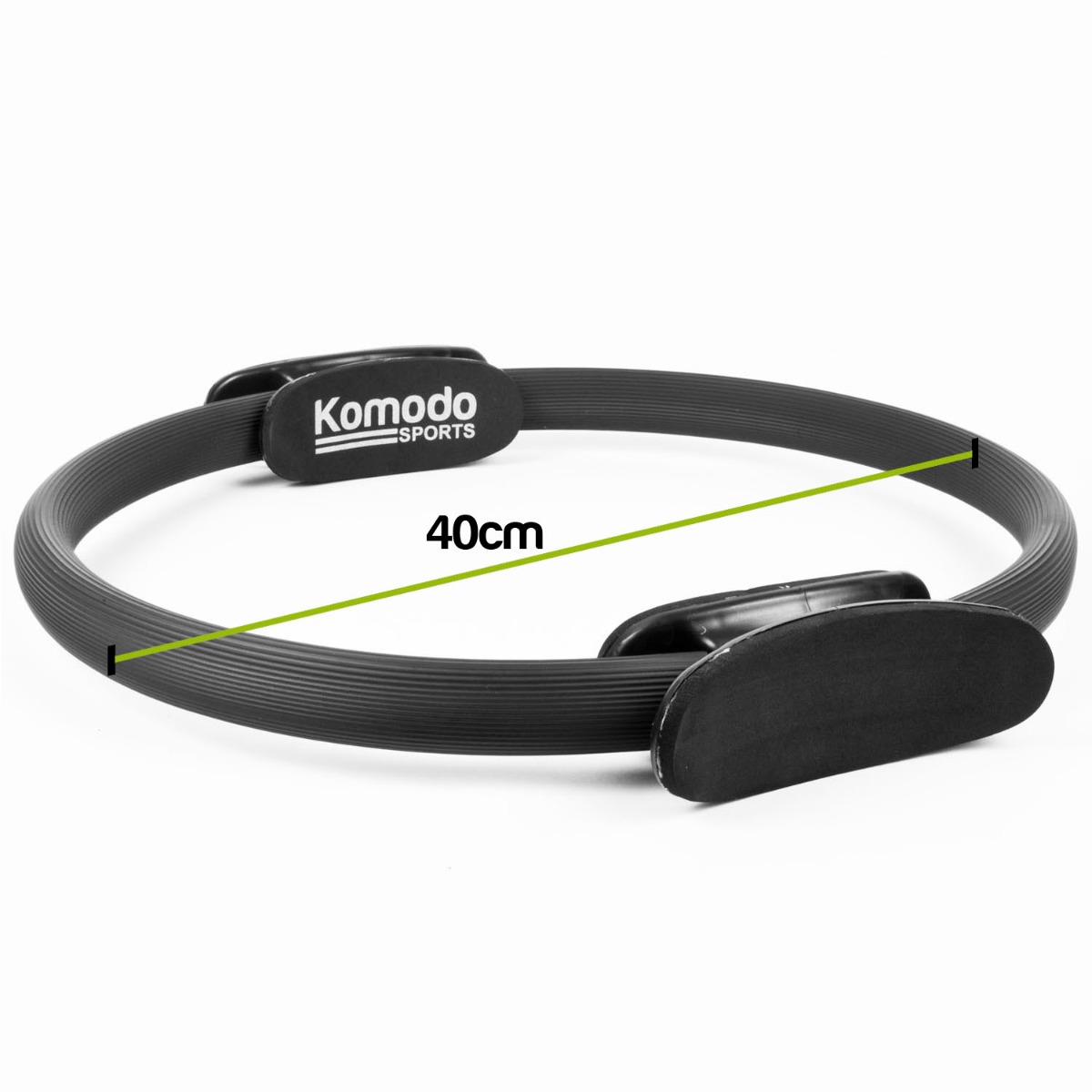 Black 15 inch pilates ring with foam padded handles resting on a white surface for fitness and stretching exercises